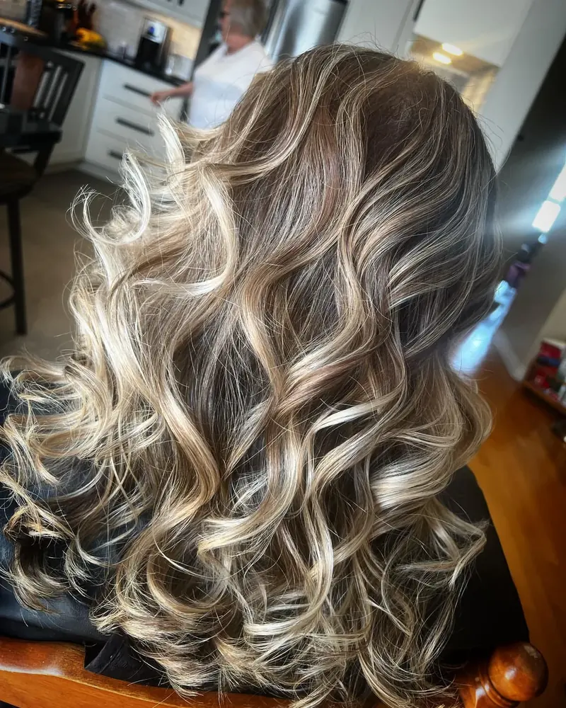 Blonde balayage with soft curls