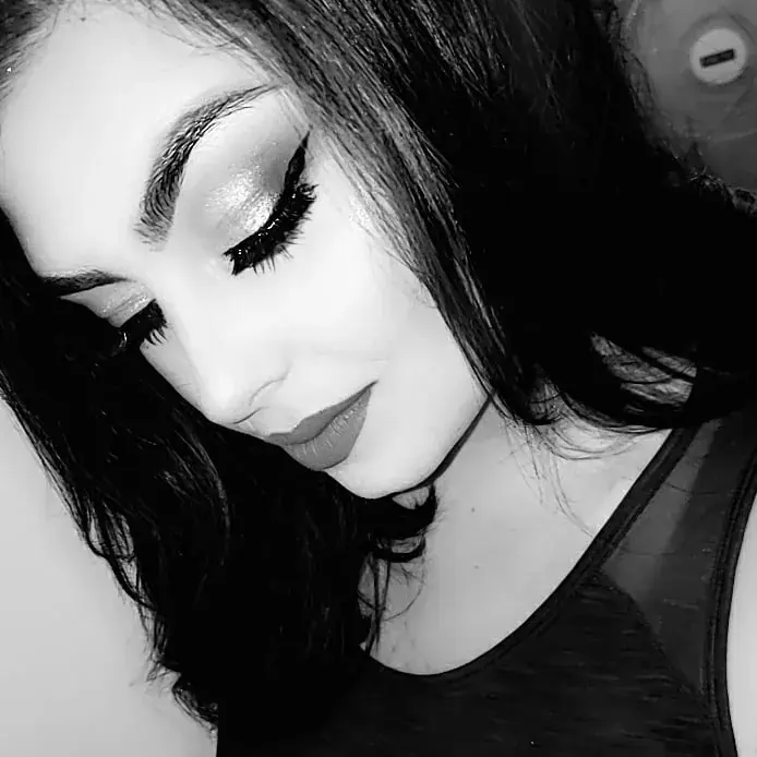 Black-and-white portrait of an intense eye makeup