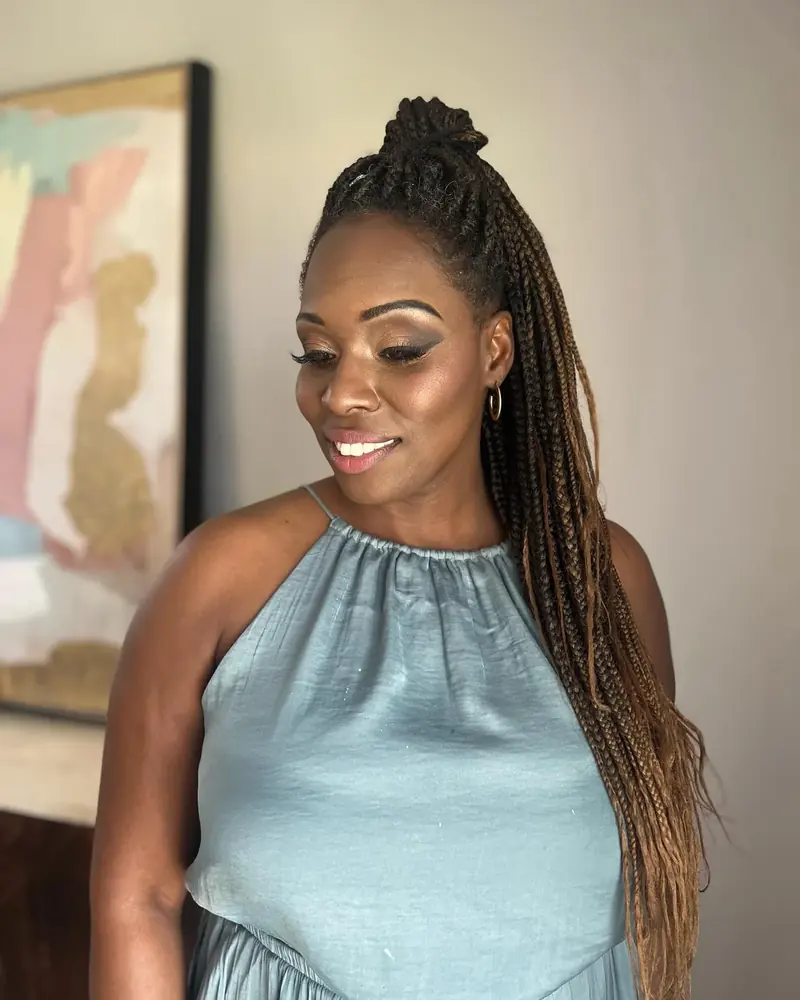 Long braids and glowing makeup